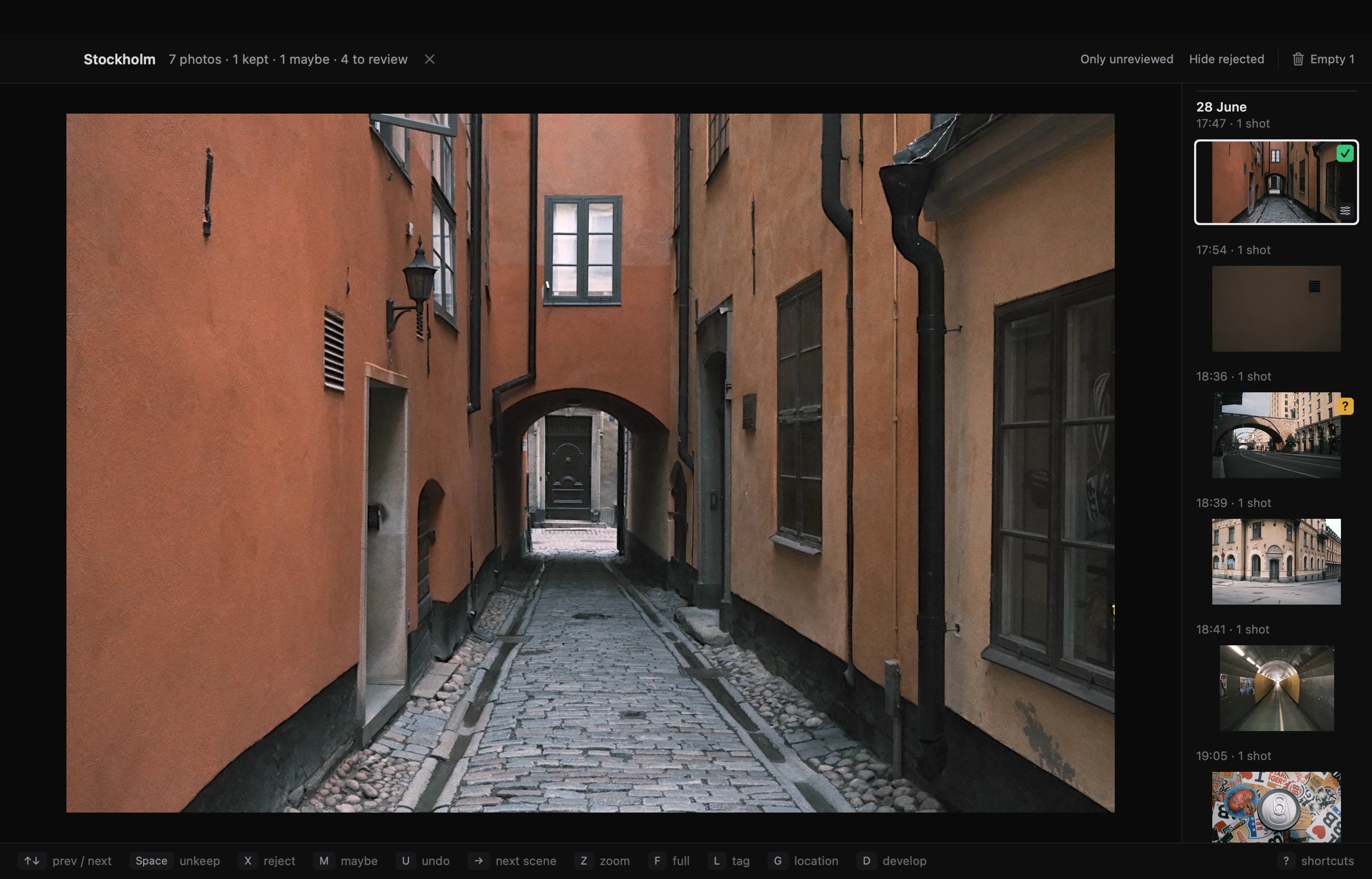 Detail of the camera roll: the first photo has a green Keep checkmark, the rejected second photo is dimmed, and the third has an amber Maybe badge.